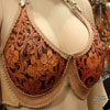 Lady's leather bra sporting Keith valleys' Sheridan Style Floral Carving with a unique use of non-traditional orchid flowers
