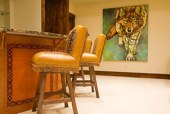Every drawer and cabinet face designed with custom cowboy interior designs that are deeply hand carved, with greatest care, on the leather. Each piece has the eye appeal and a sense of living flow. All original cowboy art designs by Keith Valley