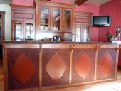 Every drawer and cabinet face designed with custom cowboy interior designs that are deeply hand carved, with greatest care, on the leather. Each piece has the eye appeal and a sense of living flow. All original cowboy art designs by Keith Valley