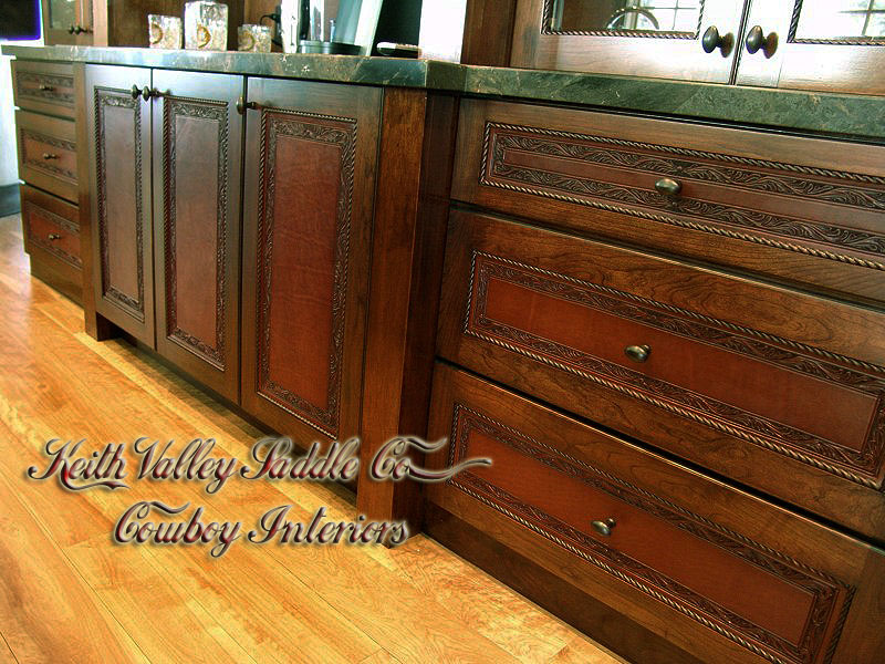 Every drawer and cabinet face designed with custom cowboy interior designs that are deeply hand carved, with greatest care, on the leather. Each piece has the eye appeal and a sense of living flow. All original cowboy art designs by Keith Valley