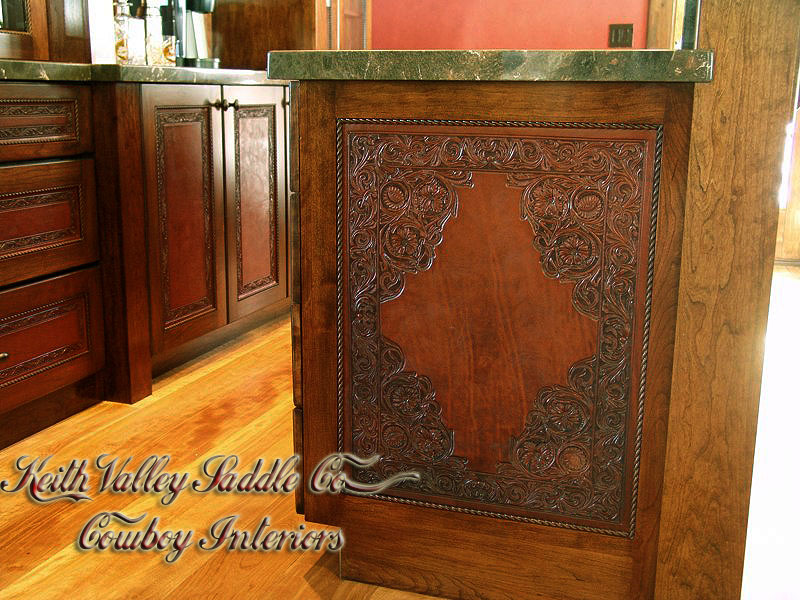 Every drawer and cabinet face designed with custom cowboy interior designs that are deeply hand carved, with greatest care, on the leather. Each piece has the eye appeal and a sense of living flow. All original cowboy art designs by Keith Valley