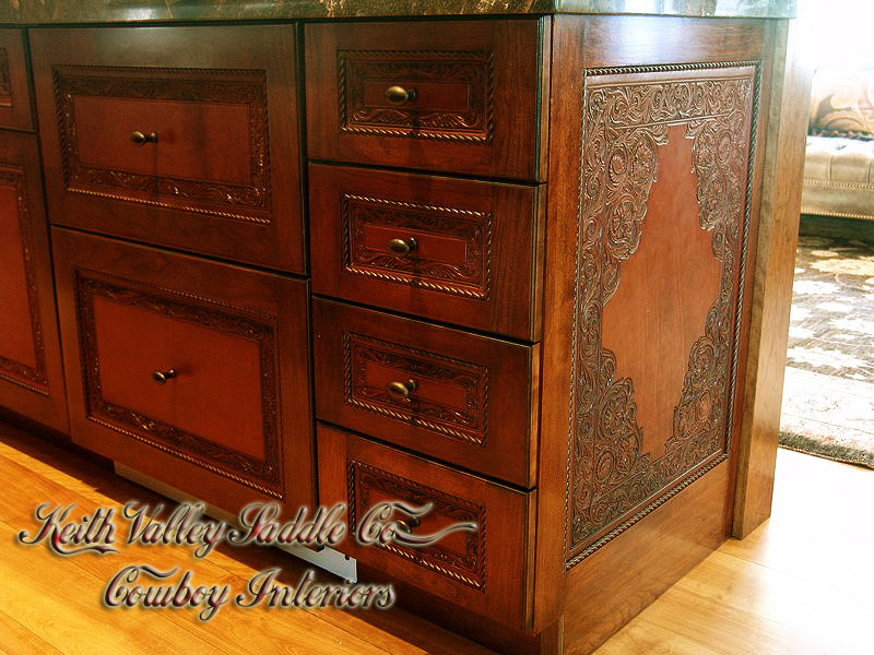 Every drawer and cabinet face designed with custom cowboy interior designs that are deeply hand carved, with greatest care, on the leather. Each piece has the eye appeal and a sense of living flow. All original cowboy art designs by Keith Valley